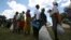 Zimbabwean villagers collect monthly food rations from Rutaura Primary School, Mt. Darwin, 254km north of Harare, March 7, 2013.
