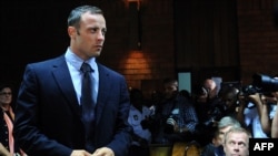 South African Olympic sprinter Oscar Pistorius appears at the Magistrate Court in Pretoria on February 22, 2013. 