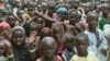 Hundreds turn out for the reopening of a government school in Limani, Cameroon. (M.E. Kinzeka/VOA)