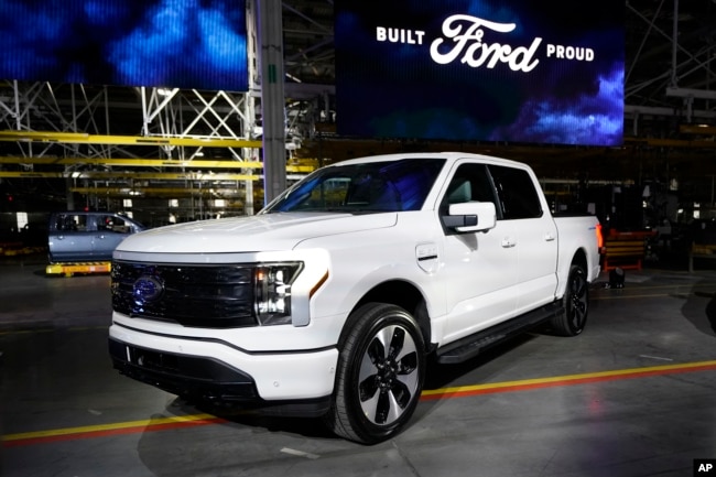 A Ford F-150 electric truck is displayed at the Rouge Electric Vehicle Center, Tuesday, April 26, 2022, in Dearborn, Mich. (AP Photo/Carlos Osorio)