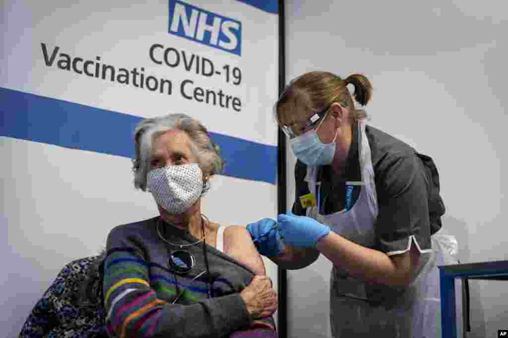 Dr Doreen Brown, 85, receives the first of two Pfizer/BioNTech COVID-19 vaccine jabs administered at Guy&#39;s Hospital in London, Dec. 8, 2020. 