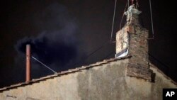 Black smoke emerges from chimney of Sistine Chapel, March 12, 2013.