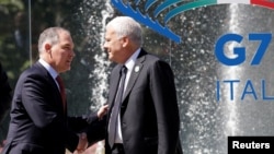 Italy's Minister of the Environment Gian Luca Galletti (R) talks with U.S. Environmental Protection Agency (EPA) Administrator Scott Pruitt during a summit of environment ministers from the G-7 group of industrialized nations in Bologna, Italy, June 11, 2