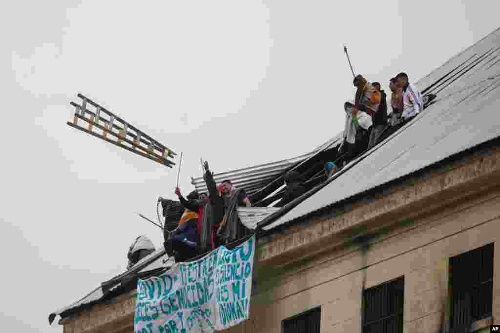 Rioting inmates protest that authorities are not doing enough to prevent the spread of coronavirus inside the prison, at the Villa Devoto prison in Buenos Aires, Argentina.