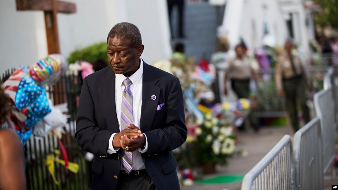 Church member Thomas Rose leaves a wake for Sen. Clementa Pinckney, one of the nine killed in last week's shooting at Emanuel AME Church, June 25, 2015, in Charleston. 