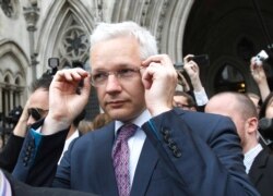 FILE - WikiLeaks founder Julian Assange leaves the High Court in London, England, July 13, 2011.