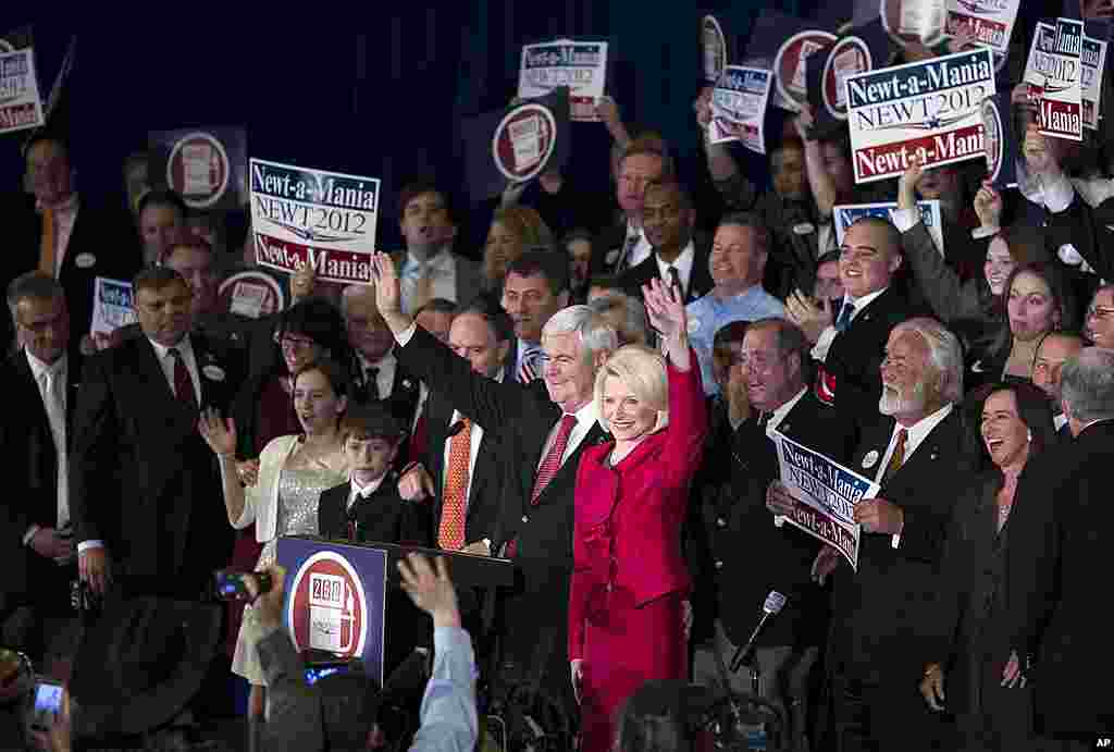 Republican presidential candidate Newt Gingrich, left, and his wife Callista wave as they arrive for a Super Tuesday rally in Atlanta, Georgia, March 6, 2012. (AP)