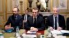 France's President Emmanuel Macron, center, France's Prime Minister Edouard Philippe, left, and France's Finance Minister Bruno Le Maire, right, attend a meeting with the representatives of the banking sector at the Elysee Palace, in Paris, Dec.11, 2018.