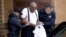 Bill Cosby is escorted out of the Montgomery County Correctional Facility, Sept. 25, 2018, in Eagleville, Pennsylvania, following his sentencing to three-to-10-year prison sentence for sexual assault.