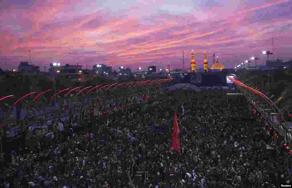 Shi'ite Muslim pilgrims gather as they commemorate Arbain in Kerbala, southwest of Baghdad. Hundreds of thousands of black-clad pilgrims from across Iraq streamed into the city a day before the culmination of Saturday's Arbain, which marks the end of 40 days of mourning for Imam Hussein, a grandson of the Prophet Mohammed.