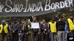 Exile Tibetan protesters mourn for Tibetan victims of self-immolation during a protest in New Delhi, India, Tuesday, Jan. 17, 2012. The protest was against lack of Tibetan representation in the ongoing border talks between India and China in New Delhi. (A