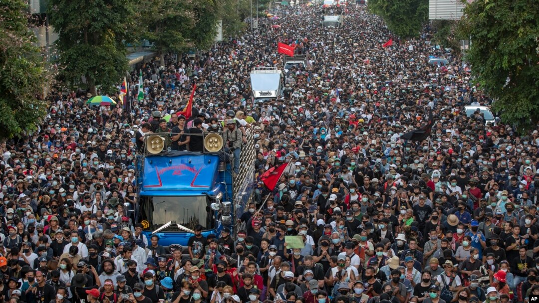 Pro-democracy protesters march during a street 