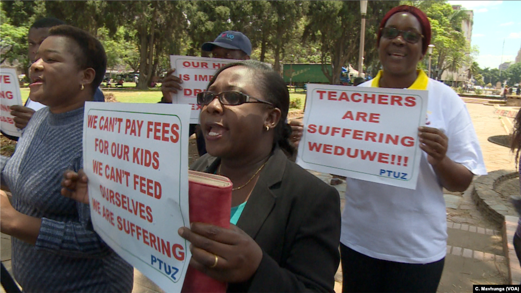 FILE - Teachers demanding to be paid in U.S. dollars take to the streets in Harare, Zimbabwe, Nov. 9, 2018. 