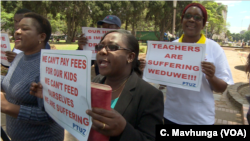 FILE: Teachers demanding to be paid in U.S. dollars take to the streets in Harare, Zimbabwe, Nov. 9, 2018. 