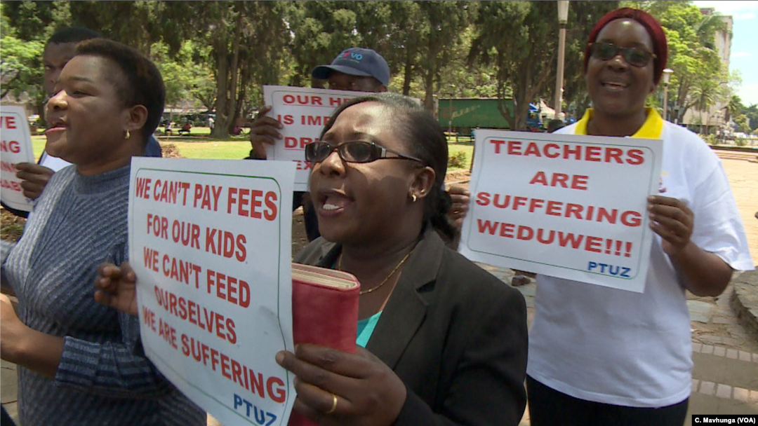 Teachers demanding to be paid in U.S. dollars take to the streets in Harare, Zimbabwe, Nov. 9, 2018. 