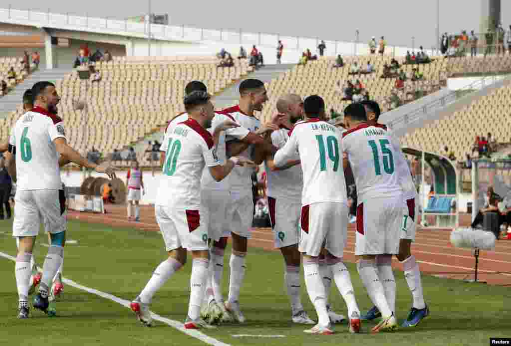 Morocco&#39;s Sofiane Boufal celebrates scoring their first goal with teammates against Egypt in Cameroon, Jan. 22, 2022.
