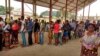 FILE - Congolese people line up to receive a vaccination against yellow fever in the Gombe district of the Democratic Republic of Congo's capital, Kinshasa, Aug. 17, 2016.