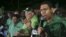 FILE - Andrew Holness (R), leader of the opposition Jamaican Labour Party, speaks to supporters at the party headquarters in Kingston, Jamaica, Feb. 25, 2016. 