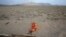 FILE - A Turkana man sleeps on the western shore of Lake Turkana close to Todonyang near the Kenya-Ethiopia border in northern Kenya, Sept. 25, 2014. 