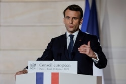 FILE - French President Emmanuel Macron delivers a press conference, in Paris, France, Feb. 25, 2021.