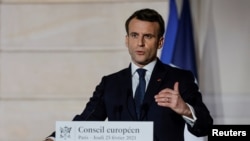 FILE - French President Emmanuel Macron delivers a press conference, in Paris, France, Feb. 25, 2021. 