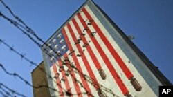 An anti-U.S. mural is seen on a wall of a government building in central Tehran, Iran, October 12, 2011.