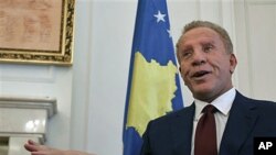 Kosovo's President Behgjet Pacolli, gestures during an interview with The Associated Press in his office, hours before Kosovo's top court is to disclose details of a ruling saying Pacolli's election violated the constitution, in capital Pristina, March 30