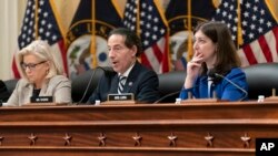 Rep. Jamie Raskin, D-Md., center, flanked by Rep. Liz Cheney, R-Wyo., left, and Rep. Elaine Luria, D-Va., speaks as the House panel investigating the Jan. 6 U.S. Capitol insurrection meets to vote on Dec. 13, 2021.