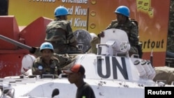 Soldiers with the UN peacekeeping force sit on top of an armored personnel carrier in the center of Goma, Eastern DRC, December 6, 2008. 