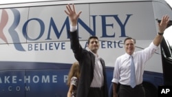 Republican presidential candidate, Mitt Romney, right, and vice presidential candidate Paul Ryan wave to the crowd in Norfolk, Virginia, August 11, 2012. 