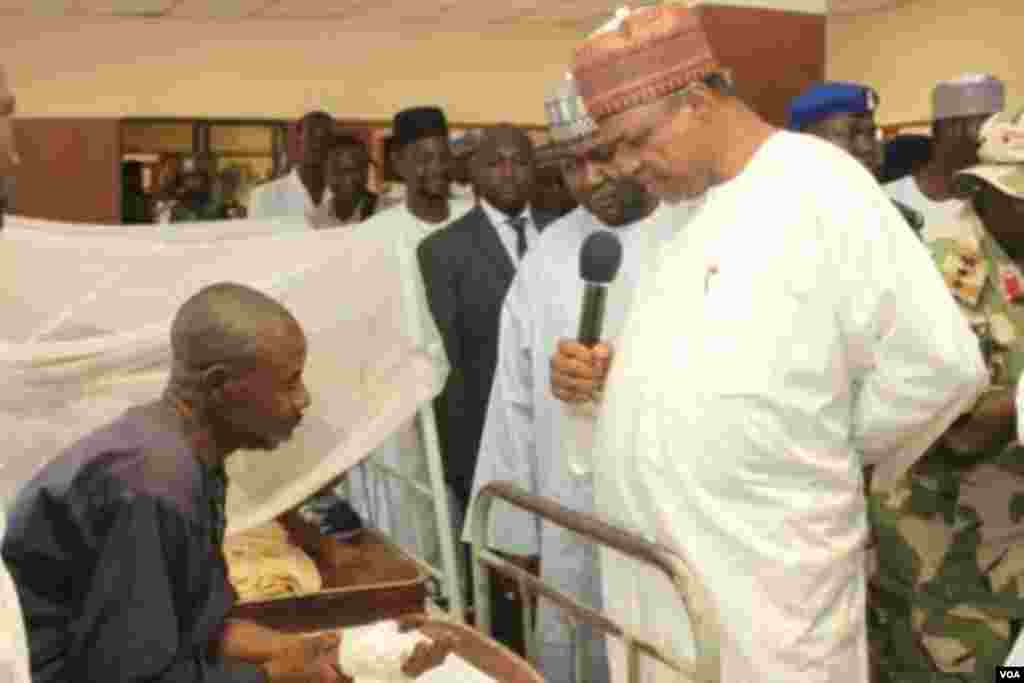 Gov. Gaidam of Yobe State sympathizing with one of the victims of Potiskum cattle market attack at the General hospital in Potiskum. The market was yesterday night attacked by unknown gunmen where they set a blaze the market killing over 50.