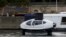 The Bubbles water taxi flies above the surface of the River Seine during a demonstration by the SeaBubbles company in Paris, France, Sept. 16, 2019. 