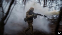 A Ukrainian serviceman of 24th Mechanized brigade trains at the polygon not far from frontline in Donetsk region, Ukraine, Jan. 21, 2024.