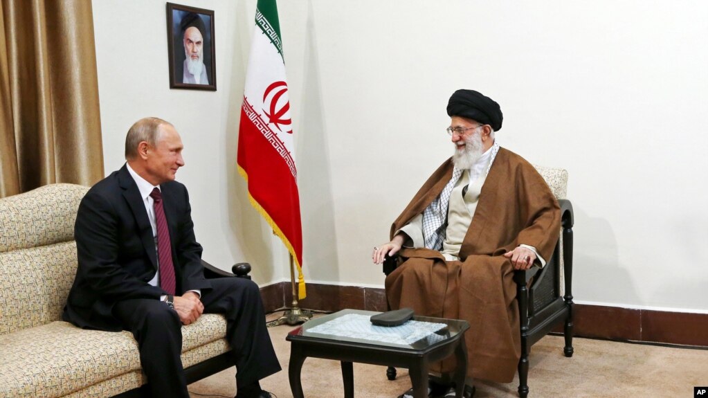 In this picture released by the office of Iran's supreme leader, Supreme Leader Ayatollah Ali Khamenei, right, speaks with Russian President Vladimir Putin during their meeting in Tehran, Iran, Nov. 1, 2017.