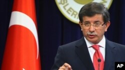 Turkish Foreign Minister Ahmet Davutoglu speaks to the media in Ankara, Turkey, September 2, 2011.