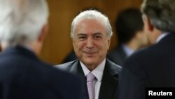 FILE - Brazil's President Michel Temer attends a meeting with political leaders at Planalto Palace in Brasilia, Brazil, Dec. 5, 2016. 