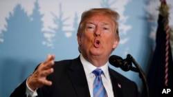 President Donald Trump speaks during a news conference at the G-7 summit in La Malbaie, Quebec, Canada, June 9, 2018. 