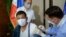 FILE - This handout photo taken May 3, 2021, and received from the Presidential Photo Division May 4, 2021, shows Philippine President Rodrigo Duterte receiving a dose of China's Sinopharm COVID vaccine at Malacanang Palace in Manila. (AFP)