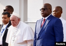 Pope Francis stands next to Democratic Republic of Congo's President Felix Tshisekedi as he attends the welcoming ceremony at the Palais de la Nation on the first day of his apostolic journey, in Kinshasa, Democratic Republic of Congo, January 31, 2023. (REUTERS/Yara Nardi)