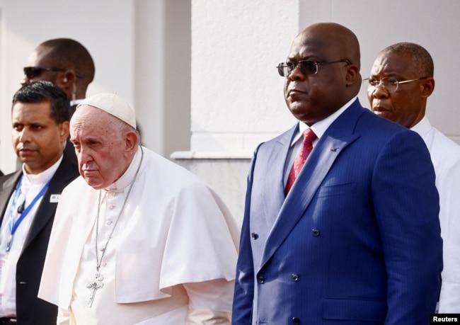 Pope Francis stands next to Democratic Republic of Congo's President Felix Tshisekedi as he attends the welcoming ceremony at the Palais de la Nation on the first day of his apostolic journey, in Kinshasa, Democratic Republic of Congo, January 31, 2023. (REUTERS/Yara Nardi)