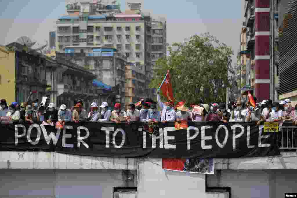 Demonstrators protest against military coup in Yangon, Myanmar, Feb. 22, 2021.