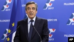 FILE - Candidate for the right-wing Les Republicains (LR) party primaries ahead of the 2017 presidential election and former French prime minister Francois Fillon delivers a speech at his campaign headquarters, Nov. 20, 2016.
