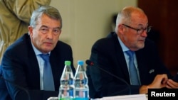 UEFA executive committee member Wolfgang Niersbach and Chairman of Swiss Football Association Peter Gillieron (R) attend the UEFA executive committee meeting in Basel, Switzerland, May 18, 2016. 