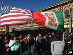 Thousands of Wisconsin activists gather in Milwaukee's predominantly Hispanic South Side to protest the county sheriff's plans to crack down on illegal immigration, Feb. 13, 2017.