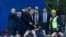 Turkey's President Recep Tayyip Erdogan, center, pushes a button to commence construction of a highway as he stands along with others on a stage during a ceremony in Sremska Raca, some 80 Km. west of Belgrade, Serbia, Tuesday, Oct. 8, 2019. Erdogan…