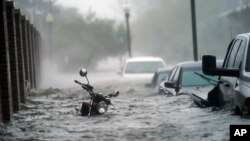 Floodwaters move on the street, Sept. 16, 2020, in Pensacola, Fla. Hurricane Sally made landfall Wednesday near Gulf Shores, Alabama, as a Category 2 storm.