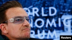 Singer Bono attends a session at the annual meeting of the World Economic Forum (WEF) in Davos, Switzerland, Jan. 24, 2014. 