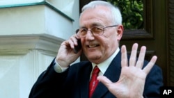 FILE - In this photo taken May 24, 2012, Josip Perkovic, suspected ex-Yugoslav secret police member, gestures as he uses a mobile phone outside a court in Zagreb, Croatia. 