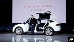 Elon Musk, CEO of Tesla Motors Inc., introduces the Model X car at the company's headquarters in Fremont, Calif., Sept. 29, 2015.