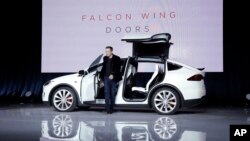 Elon Musk, CEO of Tesla Motors Inc., introduces the Model X car at the company's headquarters in Fremont, Calif., Sept. 29, 2015.